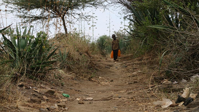 An African man on a neglected path